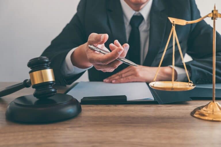 Man With Balance Scales And Judicial Gavel